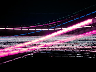 purple and pink lights on road during night time
