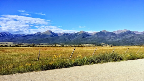 Wide open Wyoming plains under a clear blue sky.