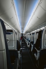 white and blue airplane seats
