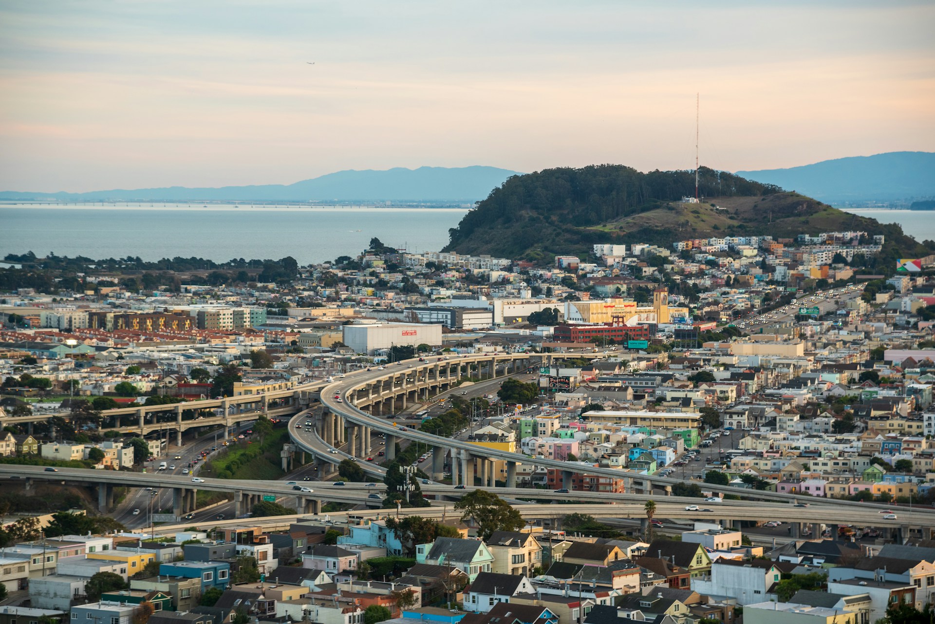 city buildings near mountain during daytime