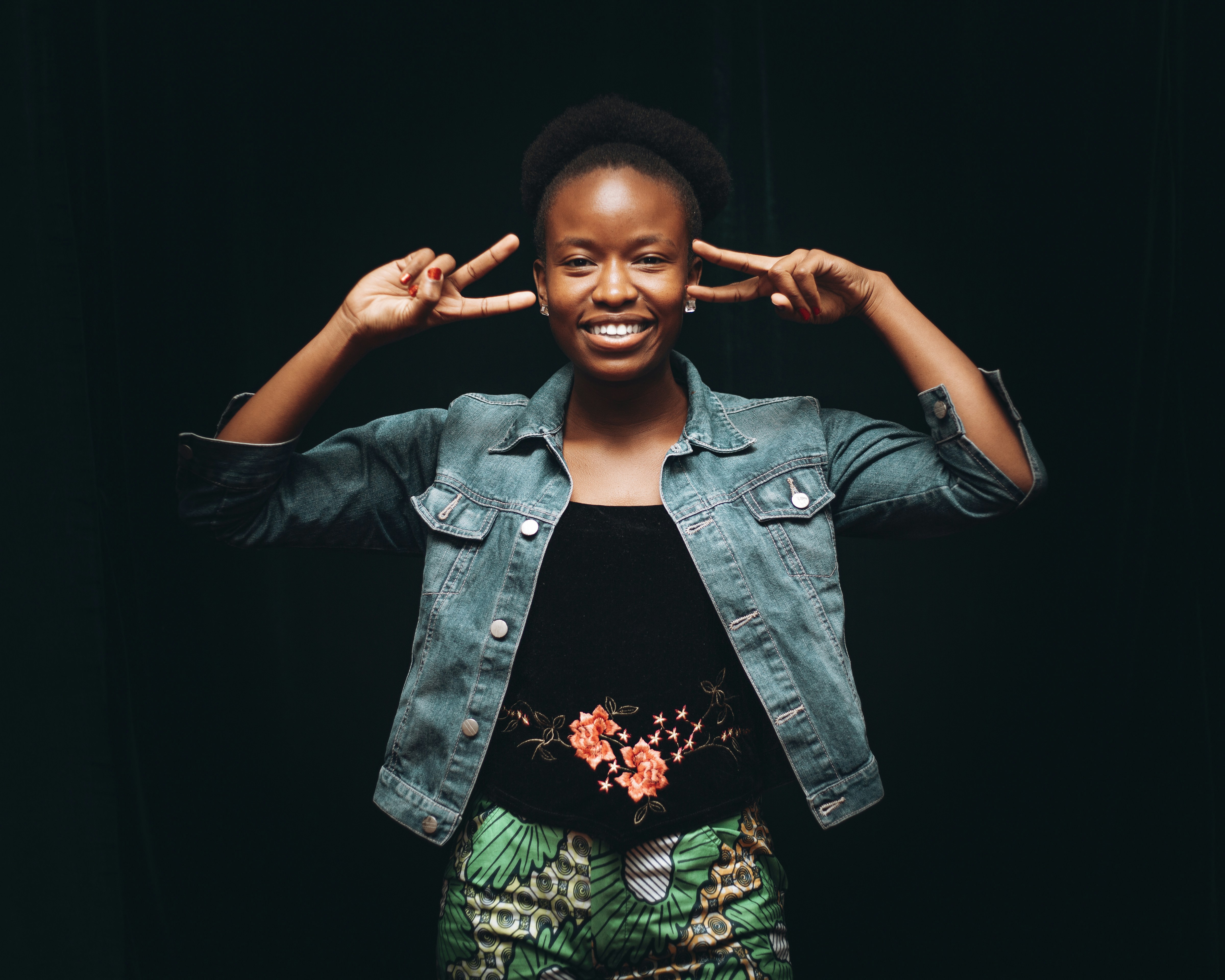 a woman with her hands behind her head