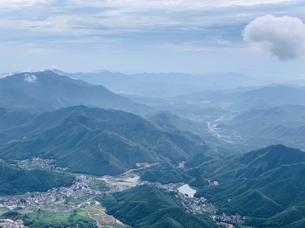 green mountains under white clouds during daytime