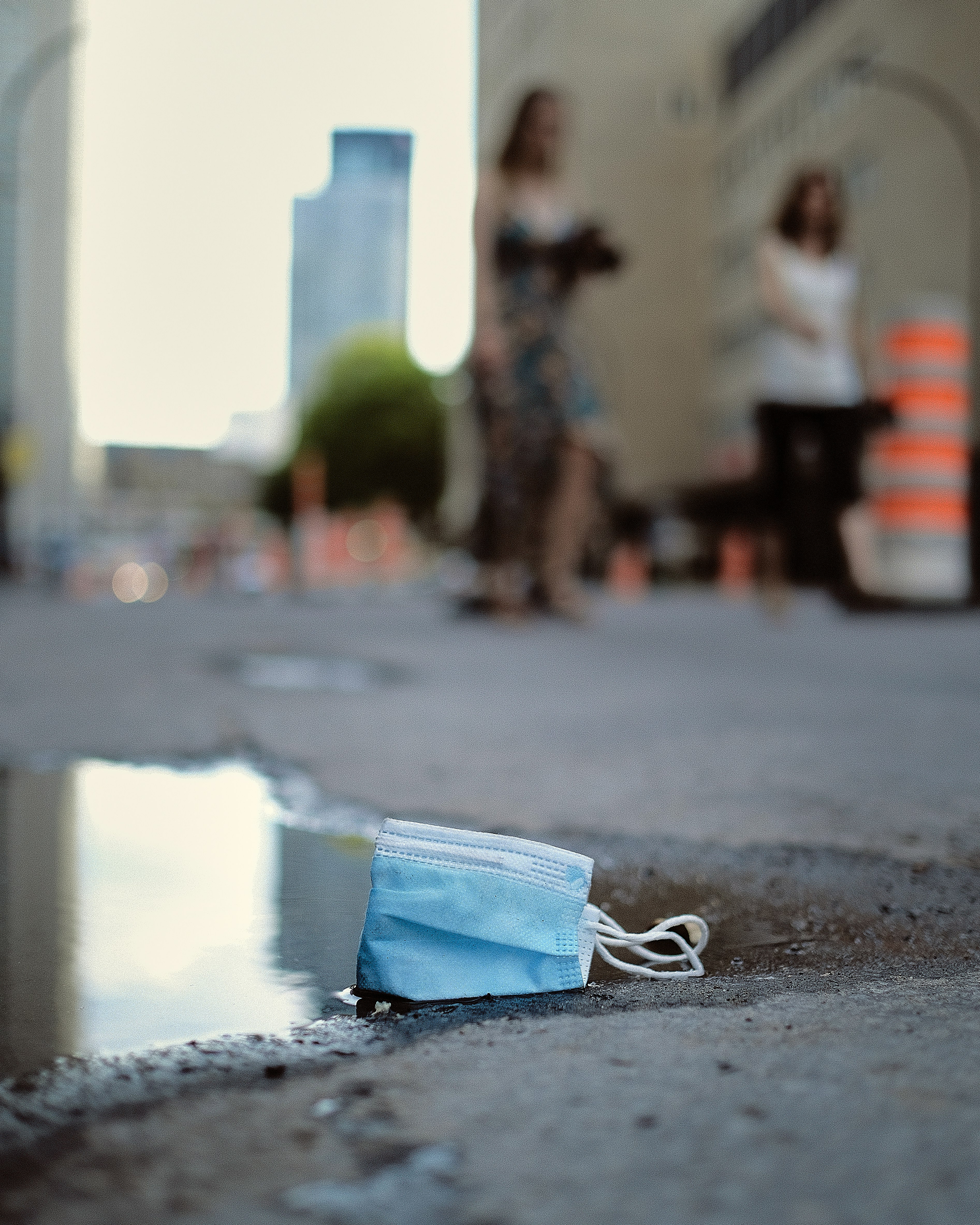 blue and white plastic pack on gray concrete floor