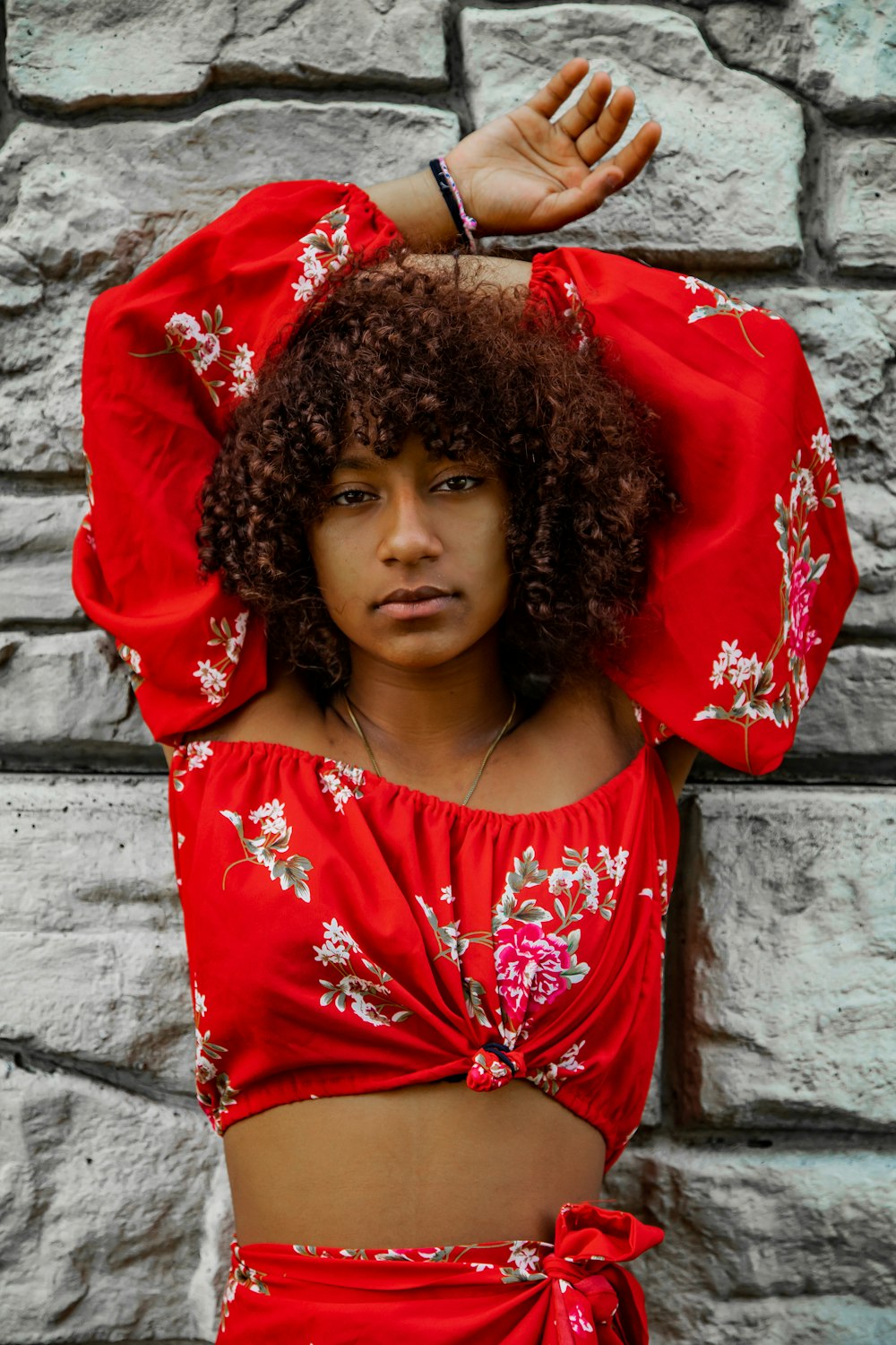 girl in red and white floral dress