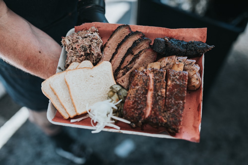 sliced meat on white ceramic plate