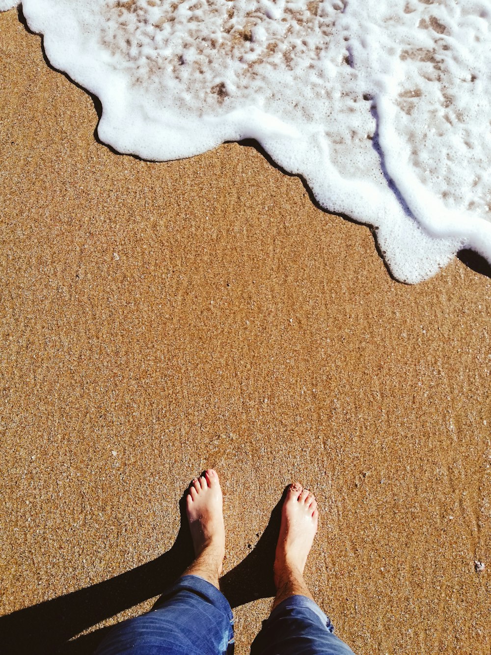 person standing on brown carpet