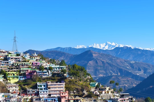 aerial view of city near mountain during daytime in Tehri India