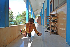 Child playing happily on a spotless floor, radiant and safe from allergens.