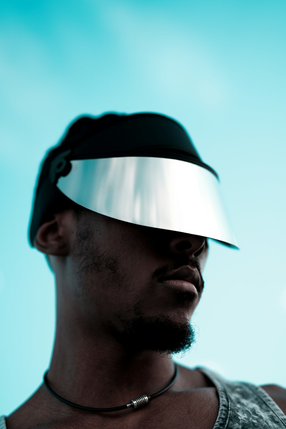 man in white and black fitted cap