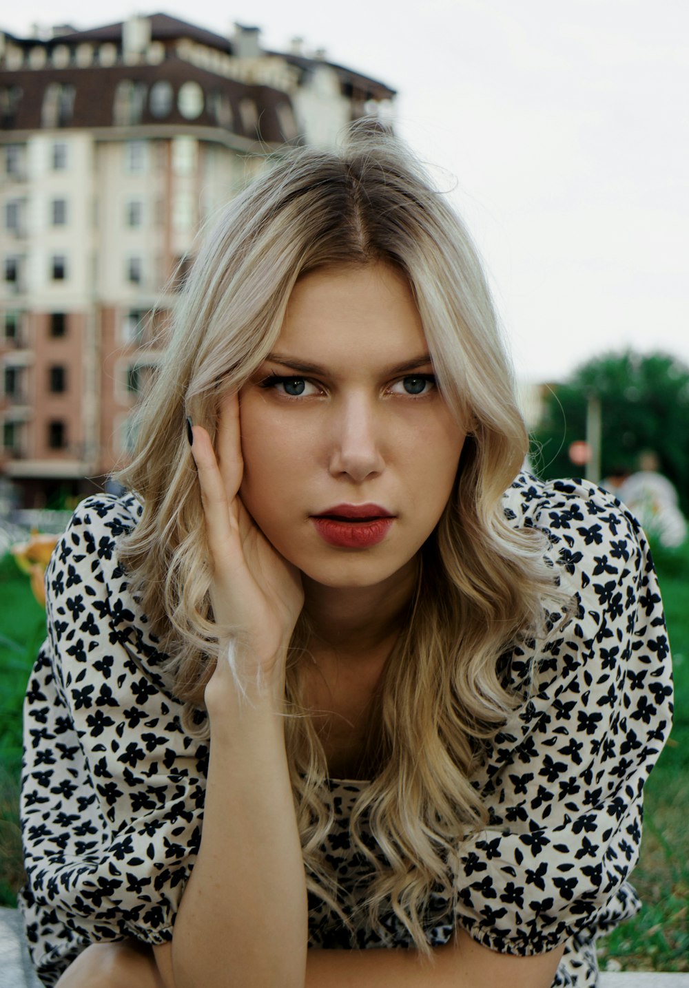 woman in black and white leopard print shirt