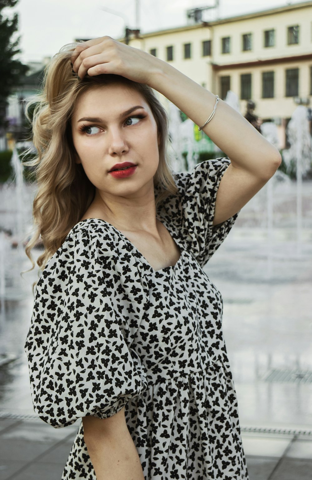 woman in black and white leopard print shirt