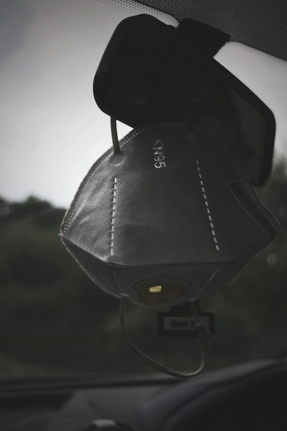 black and gray backpack on brown wooden table