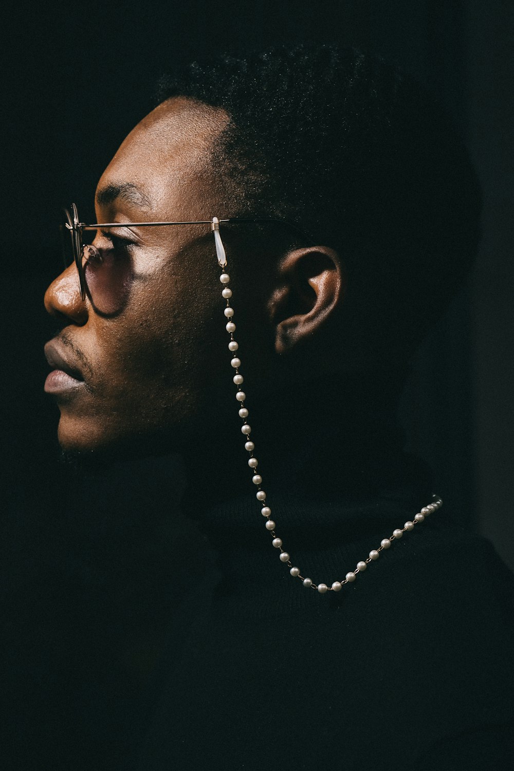 man wearing silver framed eyeglasses