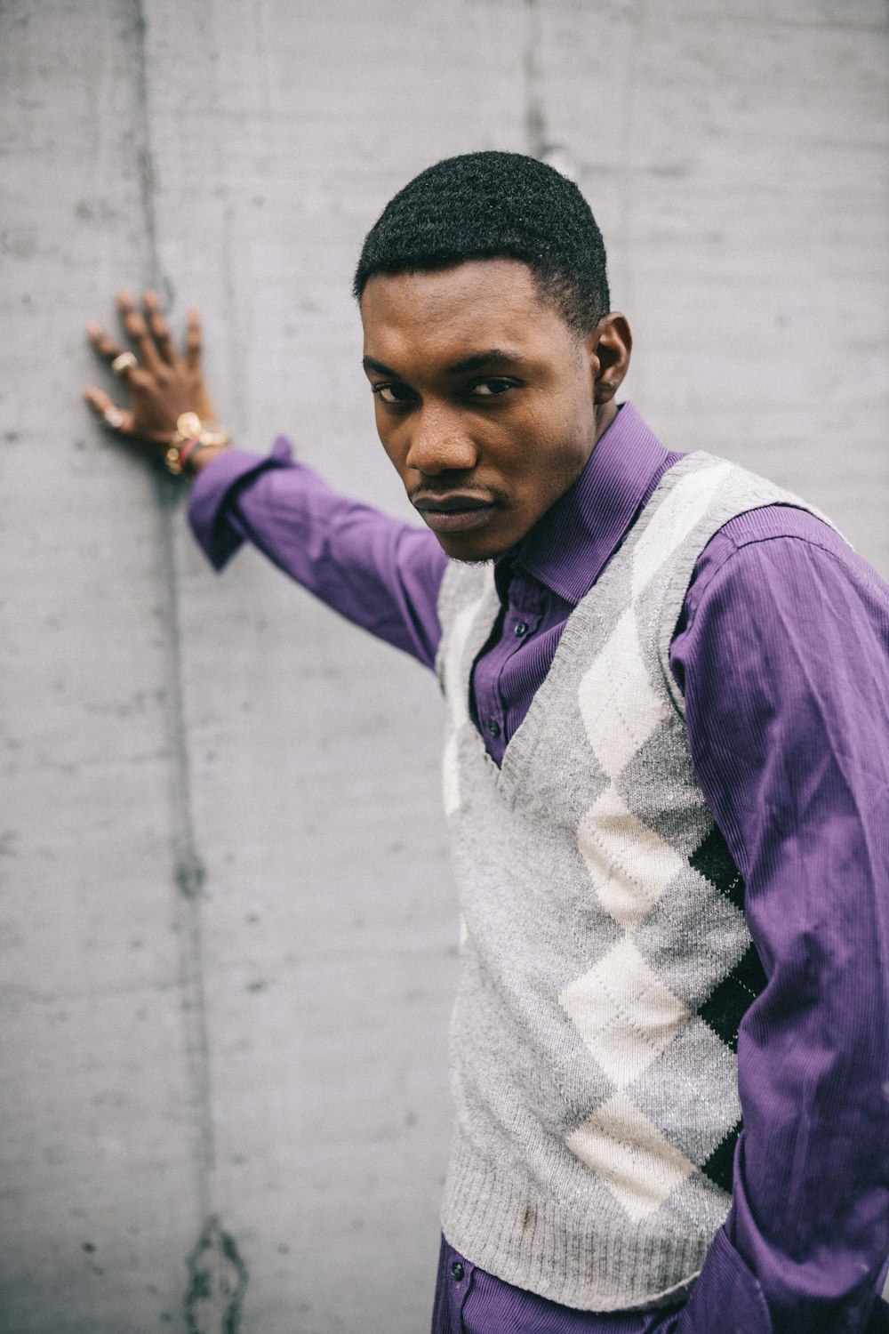 man in purple and white long sleeve shirt