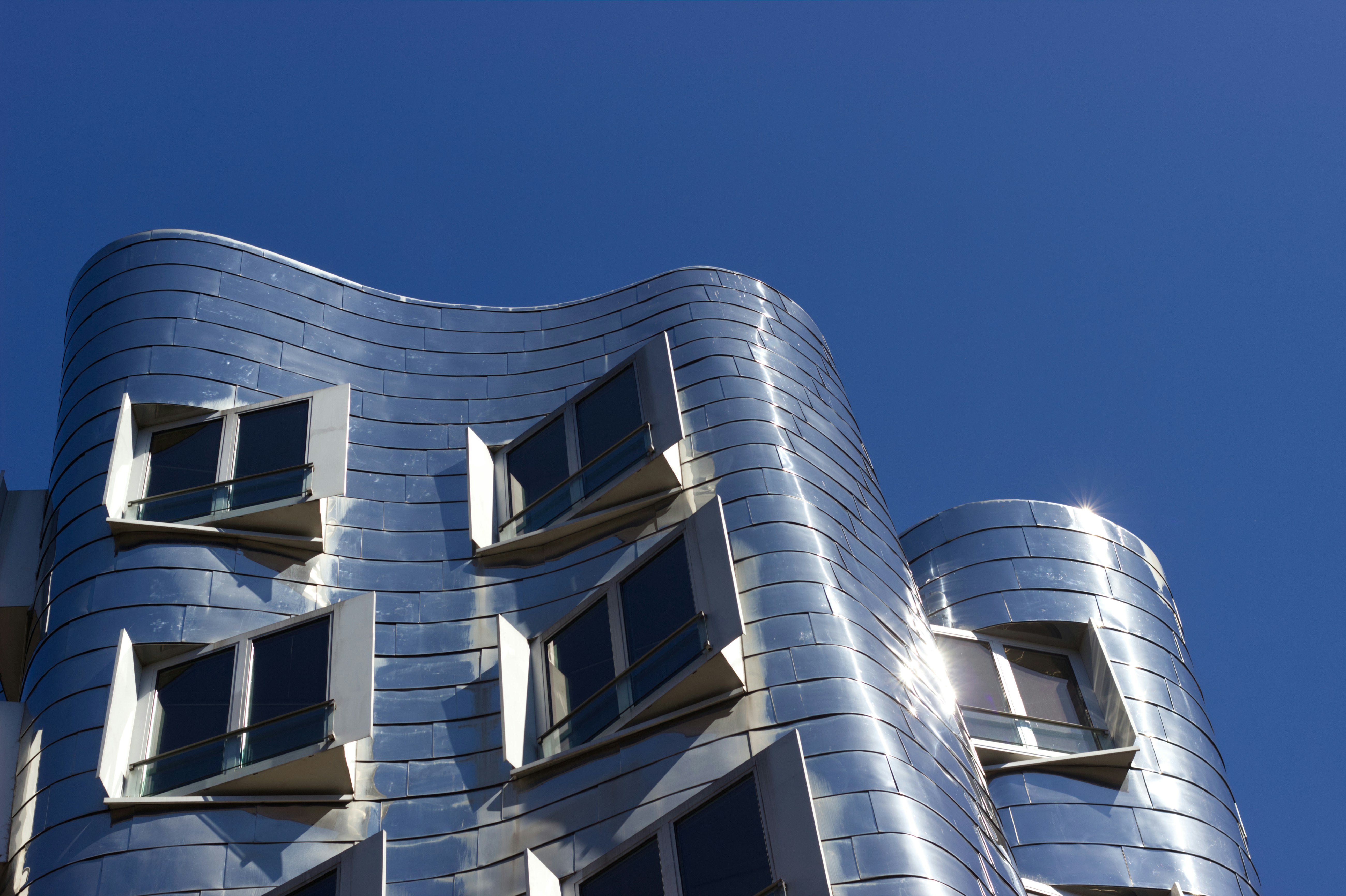 white concrete building under blue sky during daytime, 