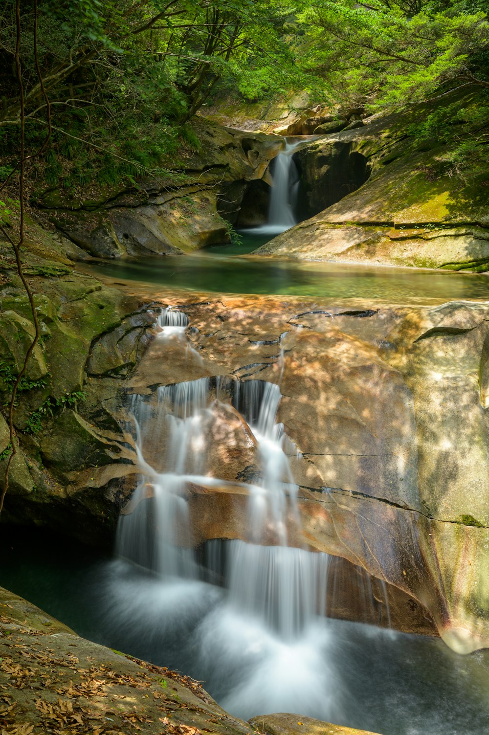 water falls on gray rock