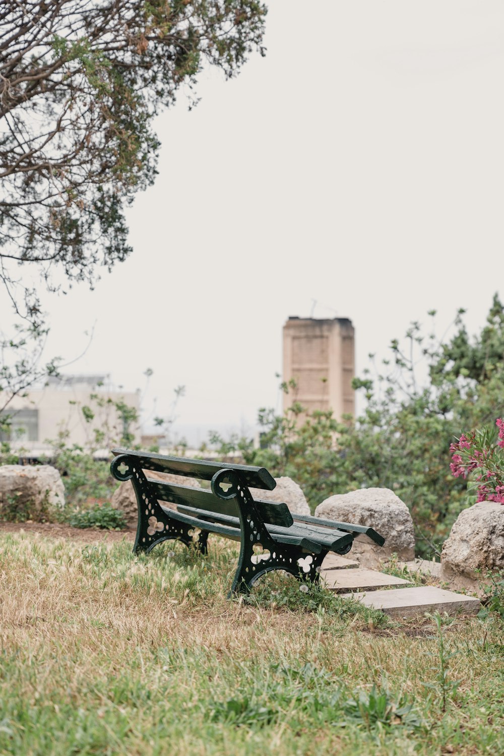 black metal bench on brown dirt ground