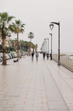 people walking on sidewalk during daytime
