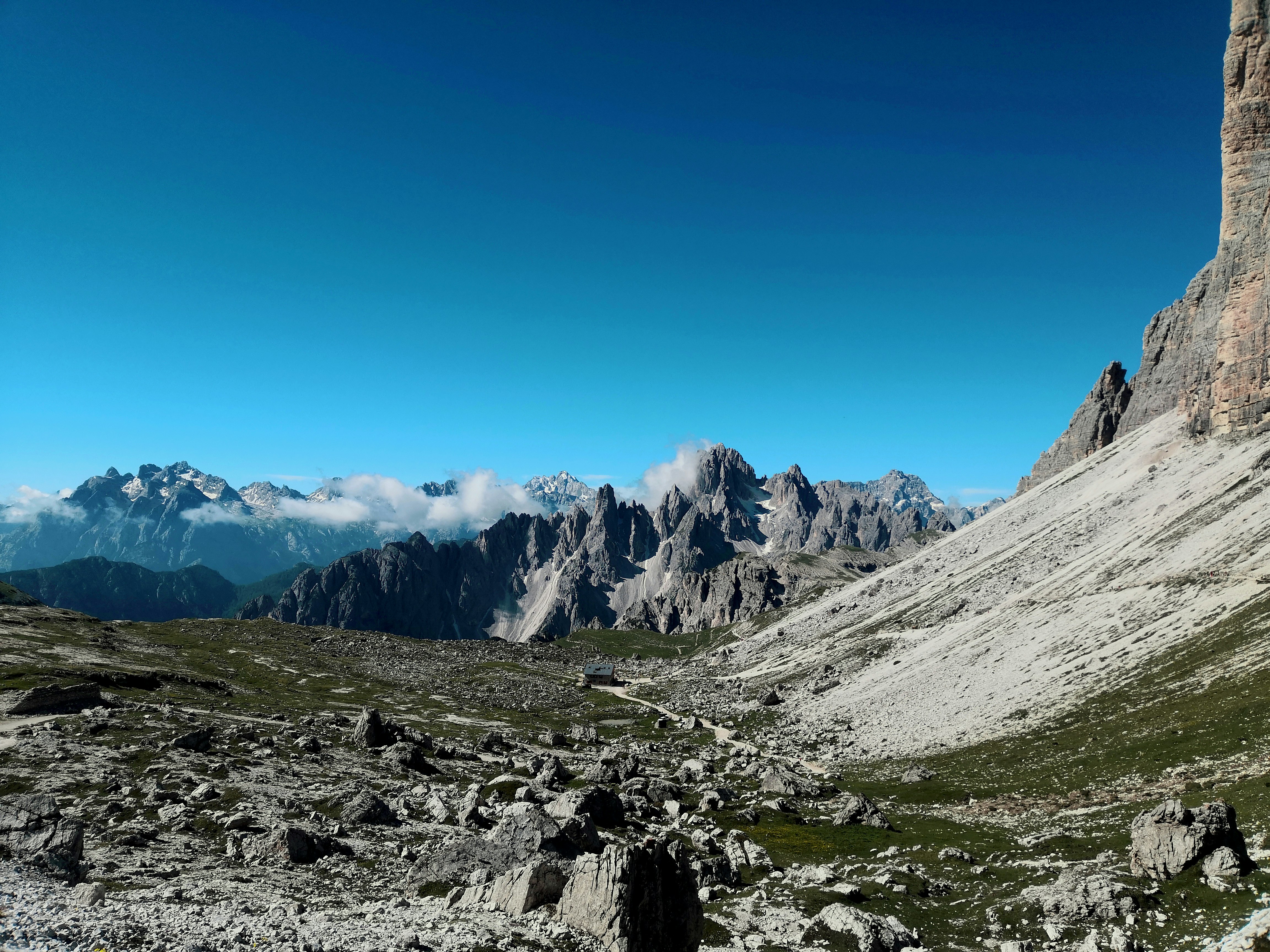 gray rocky mountain under blue sky during daytime, 