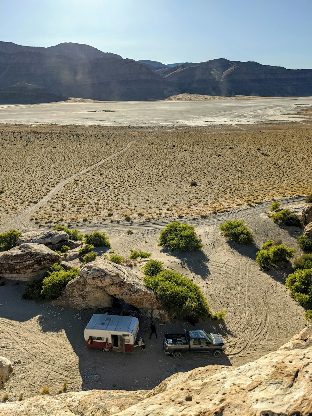 white and black van on gray sand during daytime