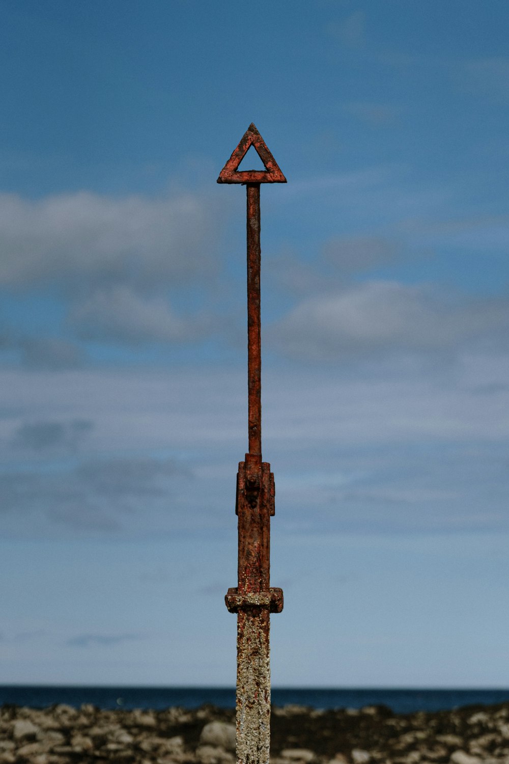 brown wooden street sign under cloudy sky during daytime