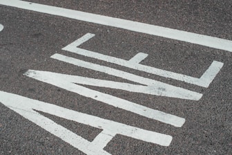 A close-up of freshly painted road markings.