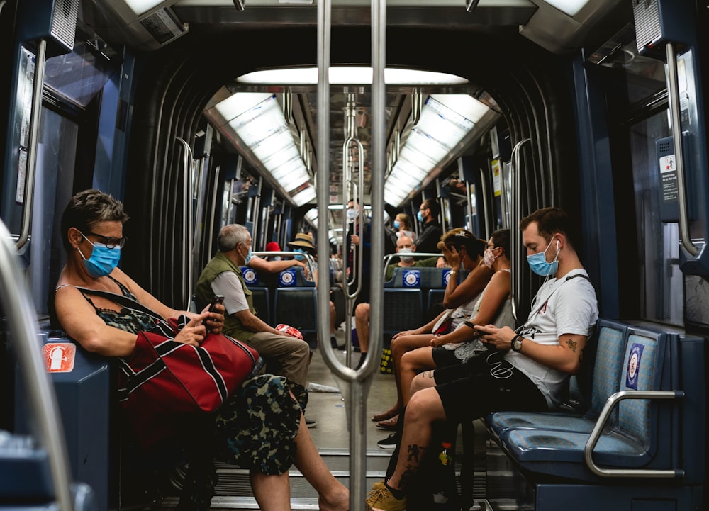 people sitting on train seat