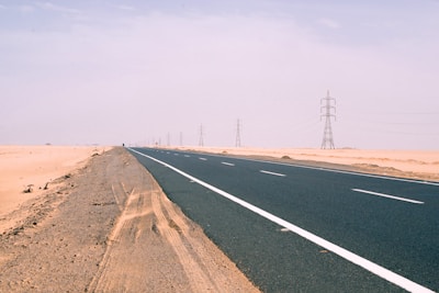 gray concrete road under gray sky