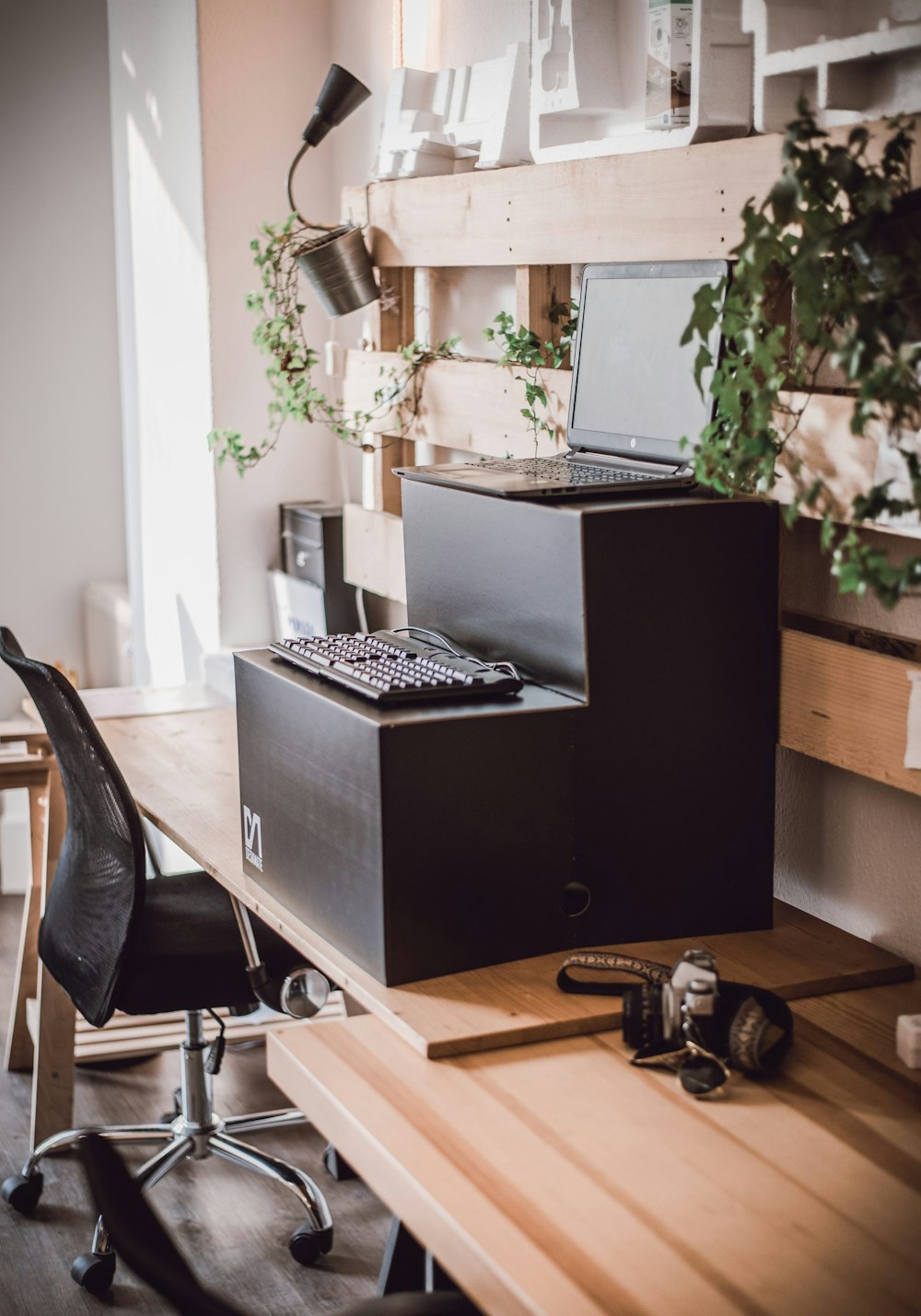 black and silver laptop computer on brown wooden desk