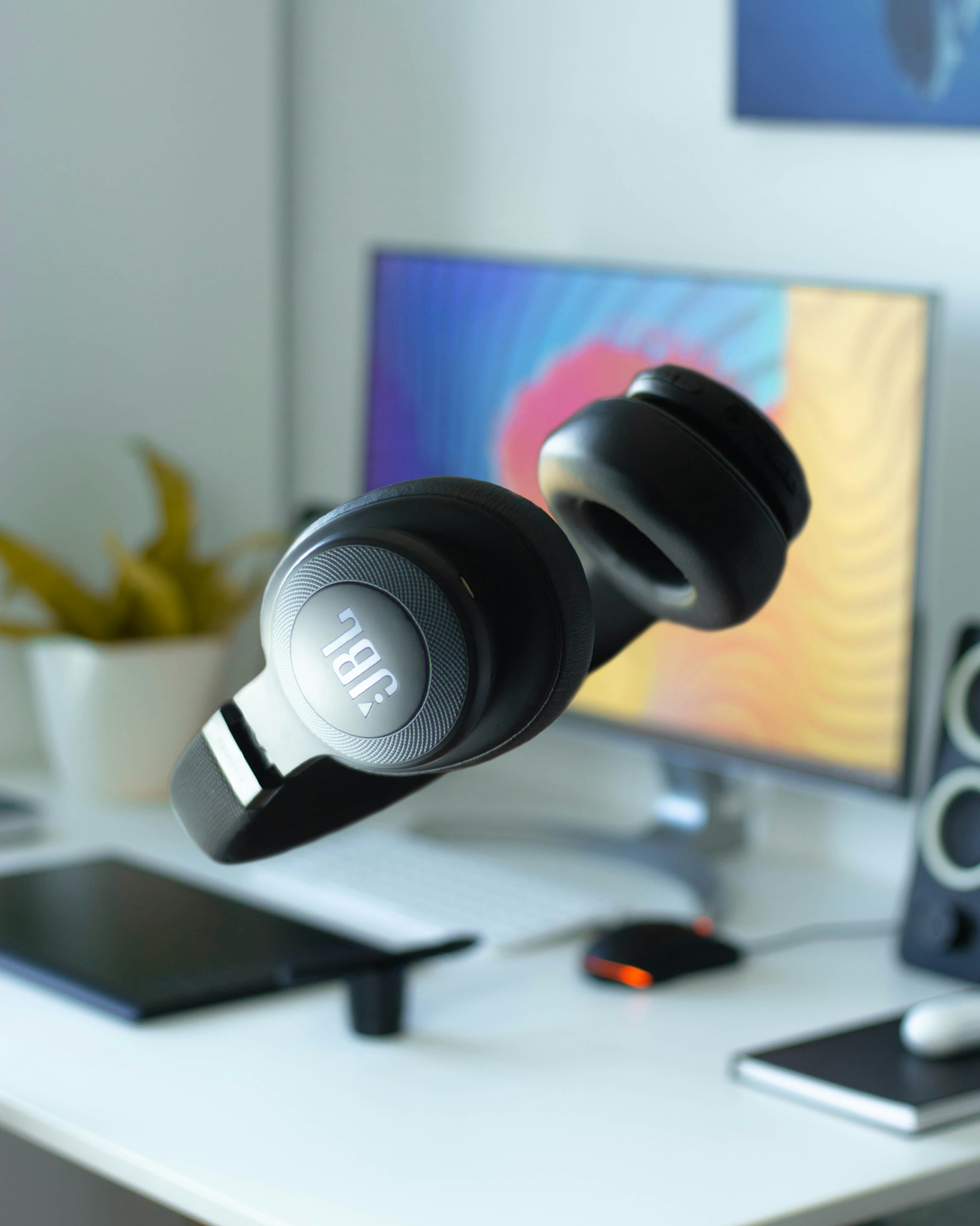 black and white headphones on white table