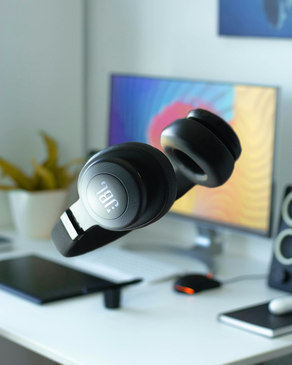 black and white headphones on white table