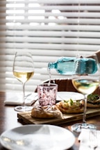 clear wine glass on brown wooden table