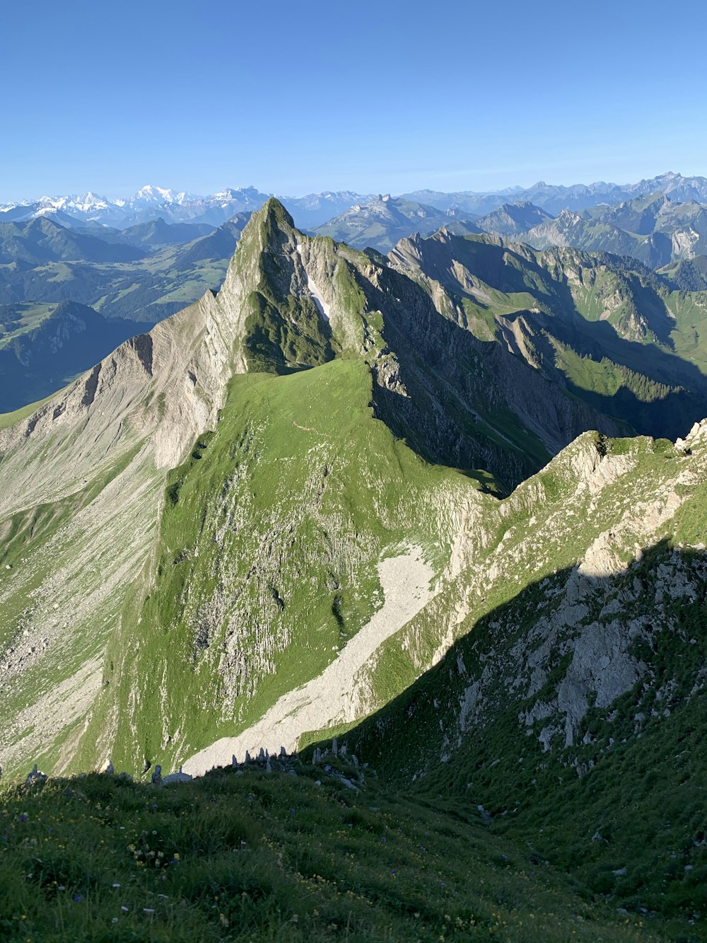 green and white mountains under blue sky during daytime