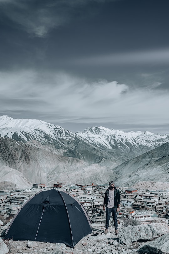 people standing near tent on snow covered ground during daytime in Nako India