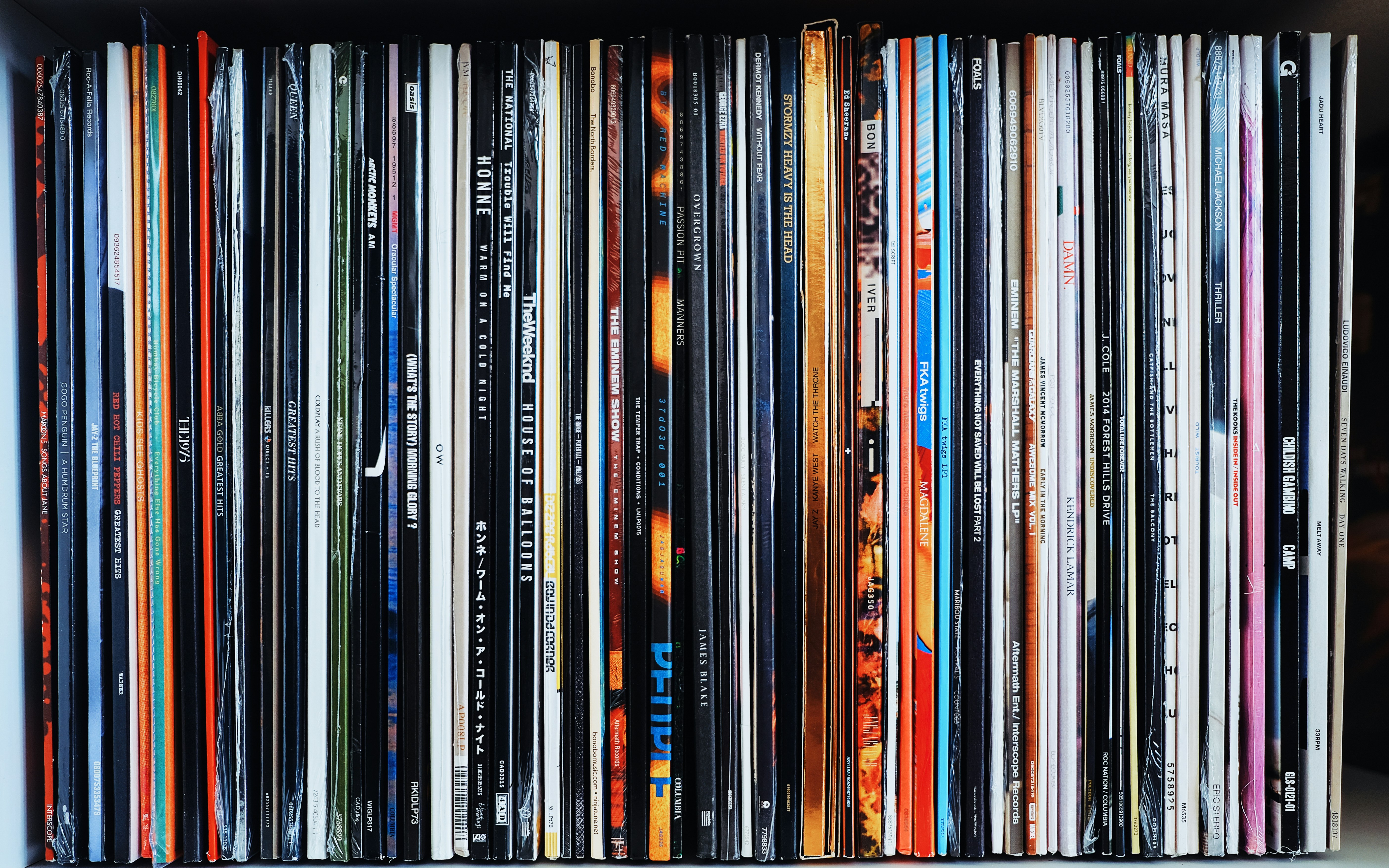 black wooden shelf with books