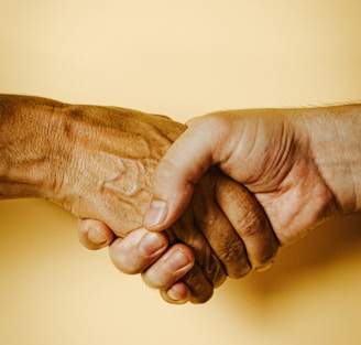 person holding babys hand