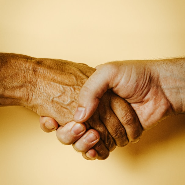 person holding babys hand