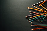 Brightly colored pencils scattered around a partially completed activity page.