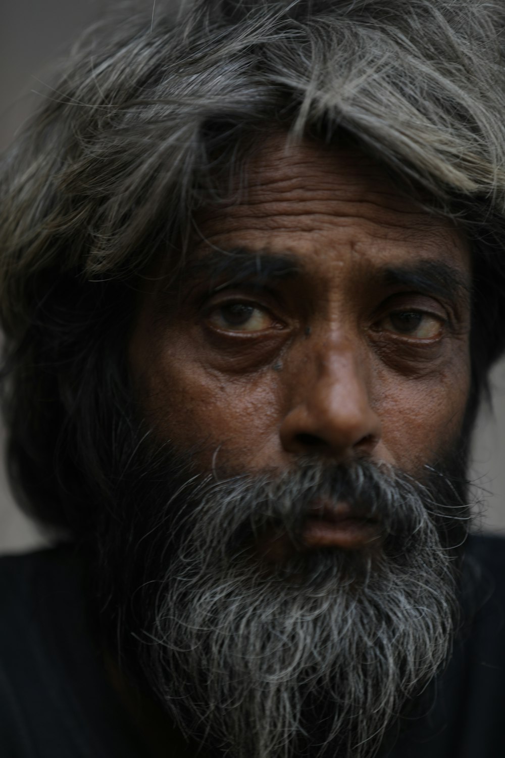 man in black shirt with brown beard