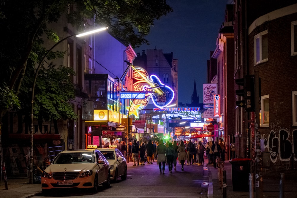 people walking on street during night time