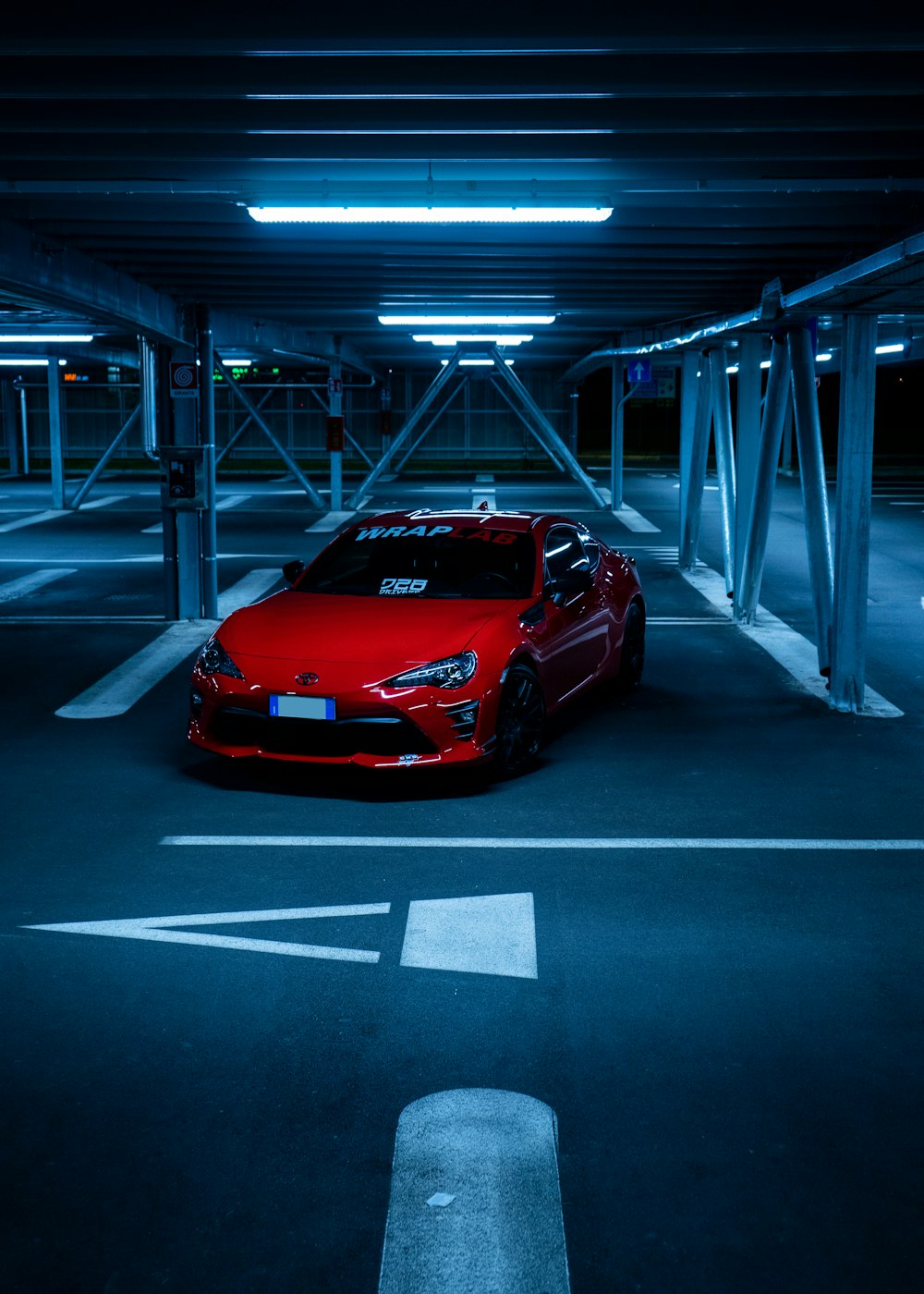 red ferrari sports car parked on parking lot