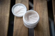 white plastic cup with white cream