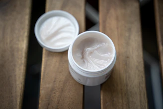 white plastic cup with white cream