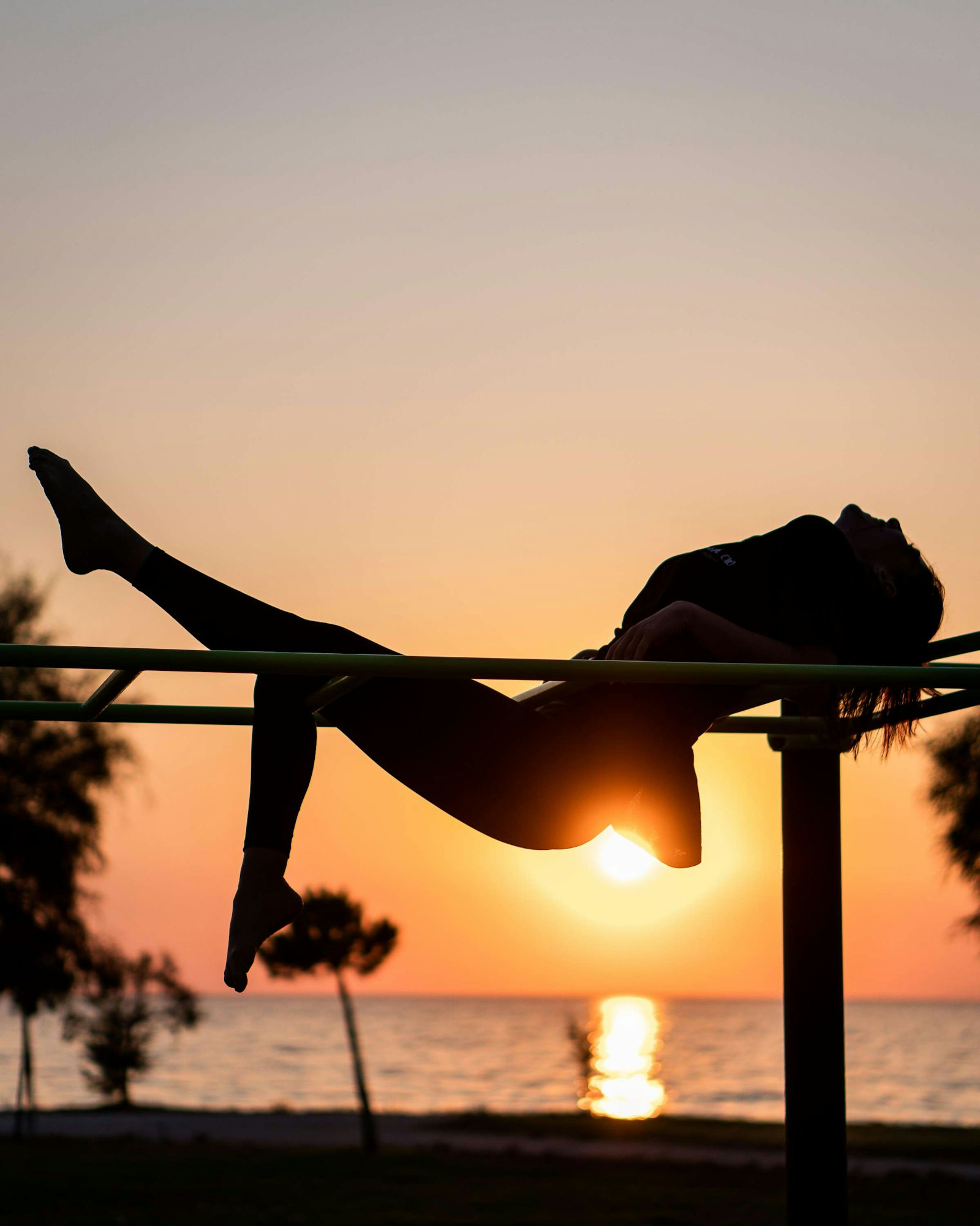 Sony a6300 + E 50mm F1.8 OSS sample photo. Silhouette of woman doing photography