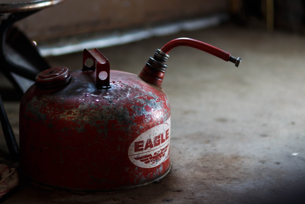 red and white plastic spray bottle