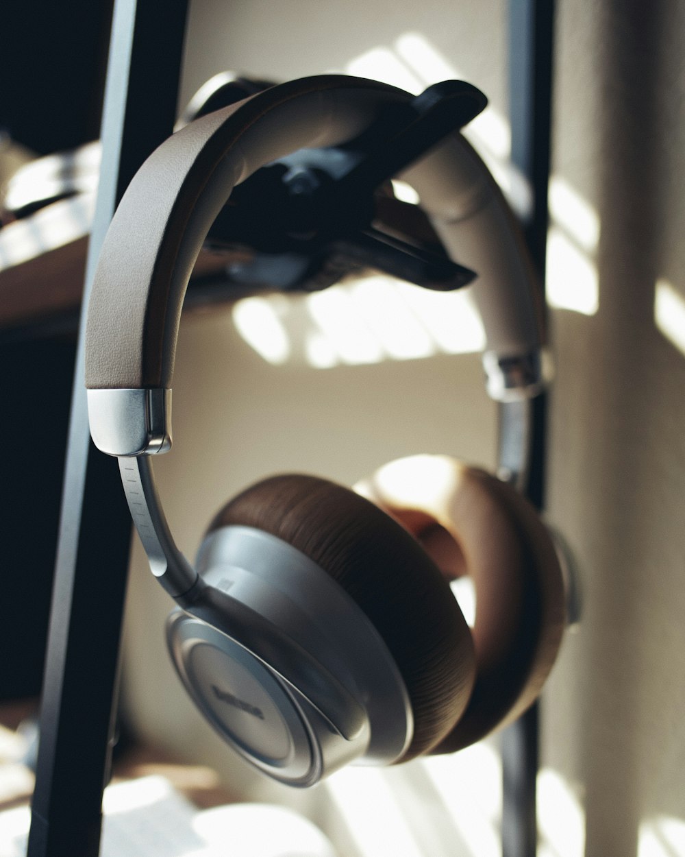 black and silver headphones on white table