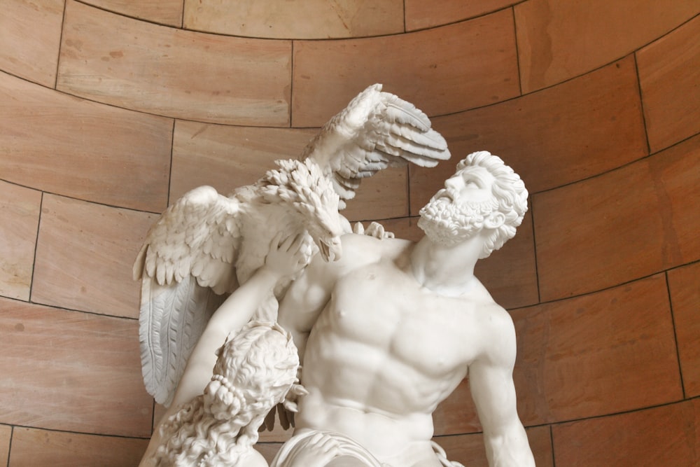 angel statue on brown wooden floor