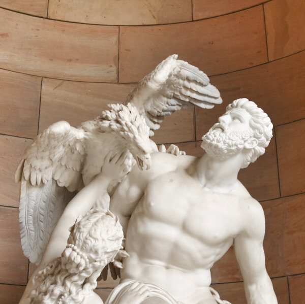 angel statue on brown wooden floor