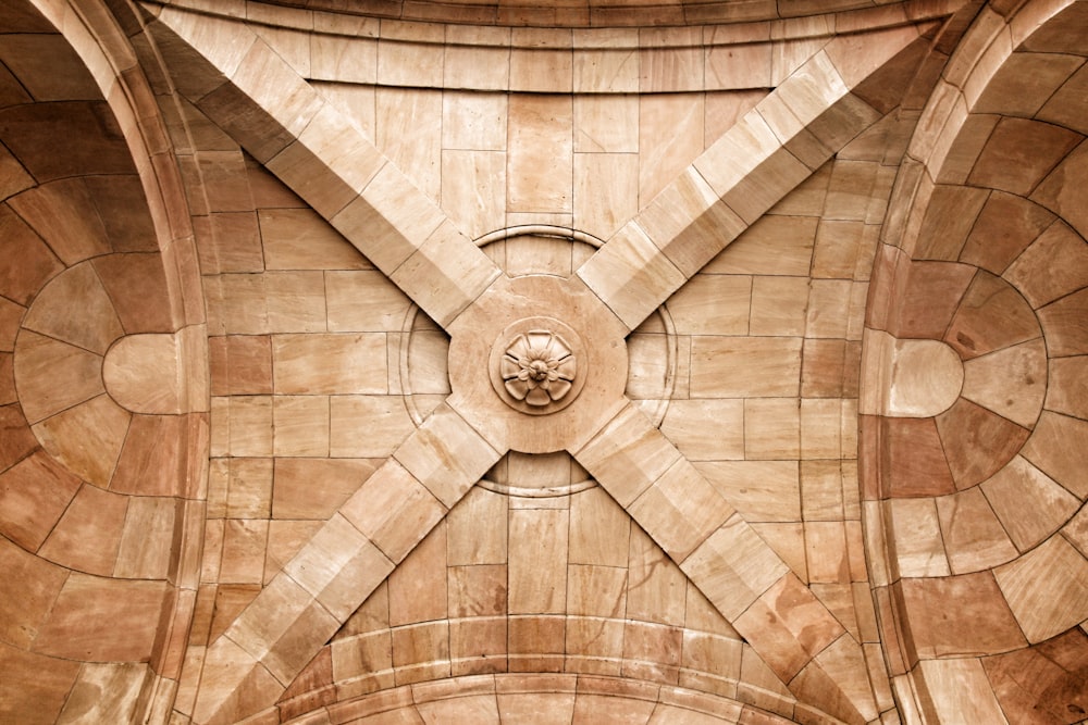 brown wooden ceiling with white round ceiling lamp