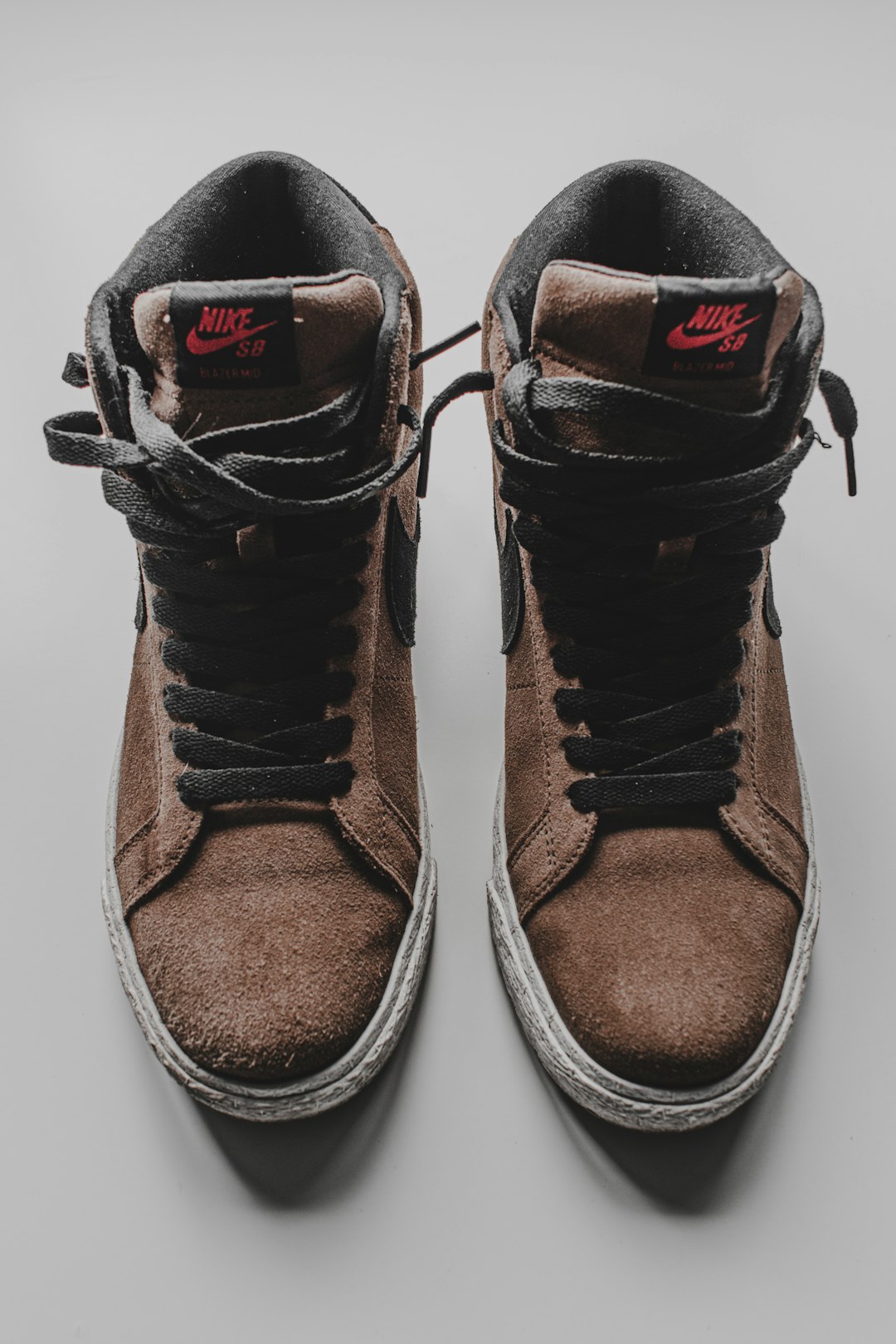 brown and black nike shoes